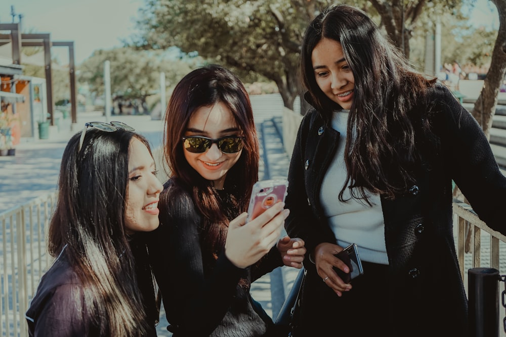 woman in black long sleeve shirt wearing brown sunglasses