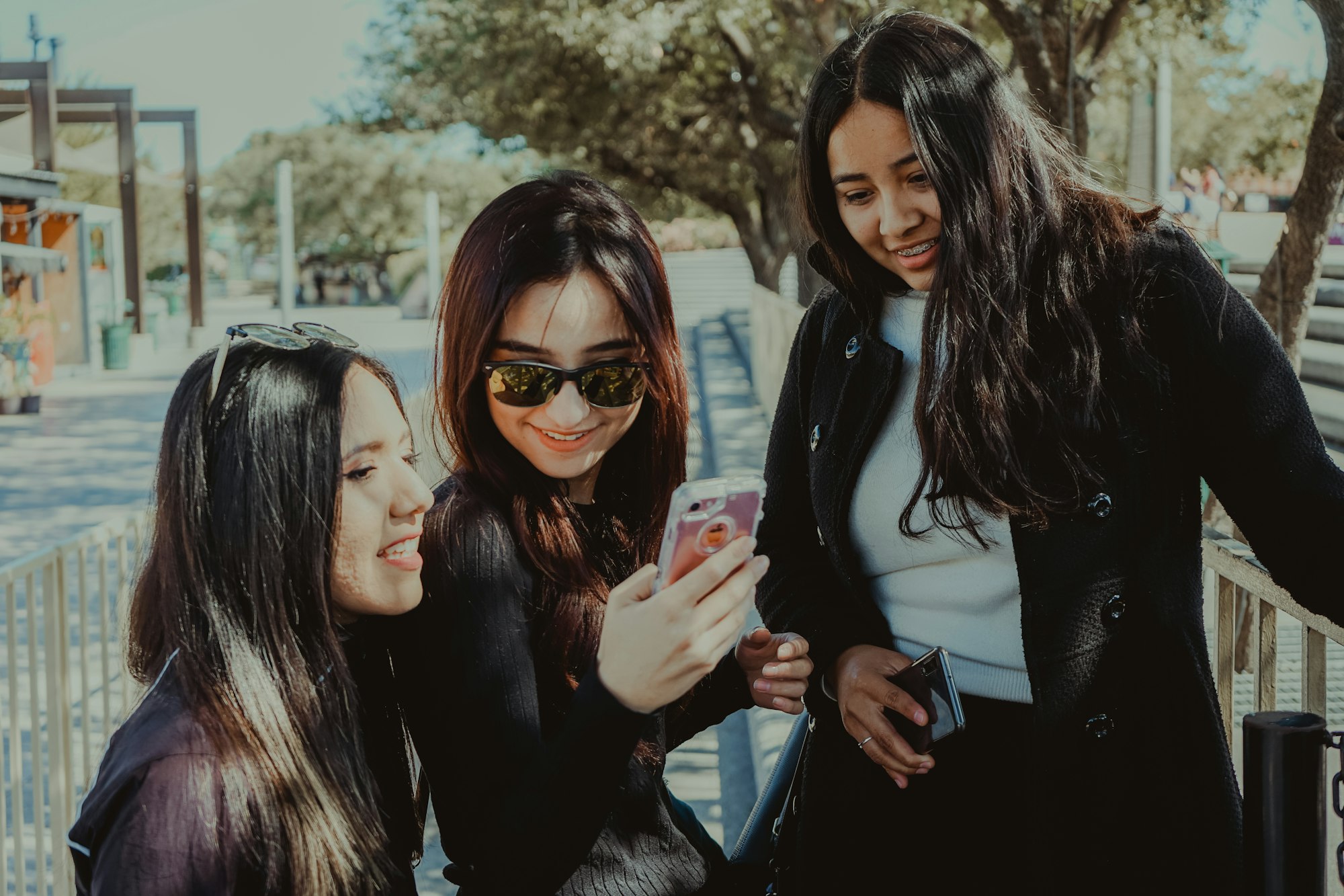 Group of women looking at a phone