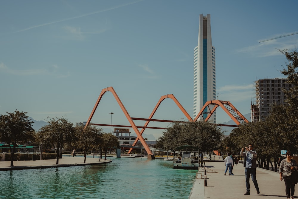 people walking on the swimming pool during daytime