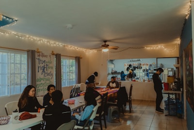 A cheerful dining room filled with guests enjoying their meals in a cozy environment.