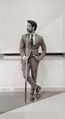 photography poses for men,how to photograph man in brown suit holding walking stick