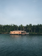 Serene backwaters in Kerala with a traditional houseboat floating