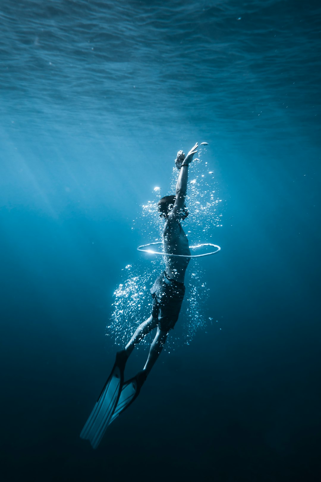 woman in black and white bikini swimming in the sea