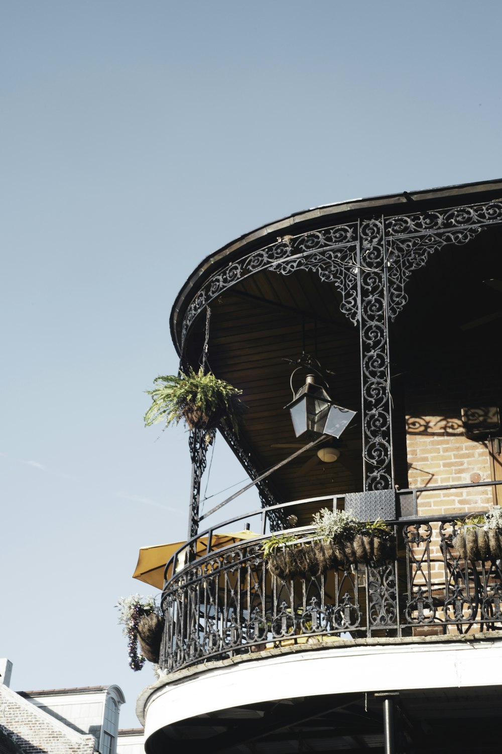 a building with a balcony and a clock on it