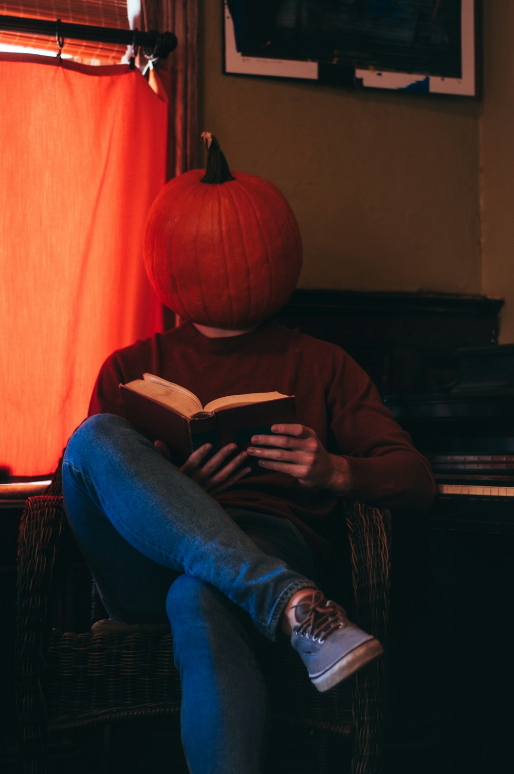 a person sitting in a chair reading a book