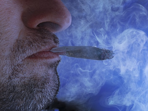 Close-up of a smoker using a safer nicotine filtration device.