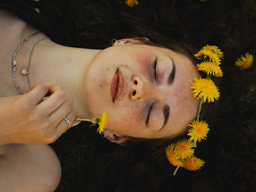 woman lying on yellow flower