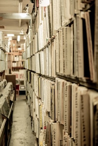 white and black labeled books on shelf