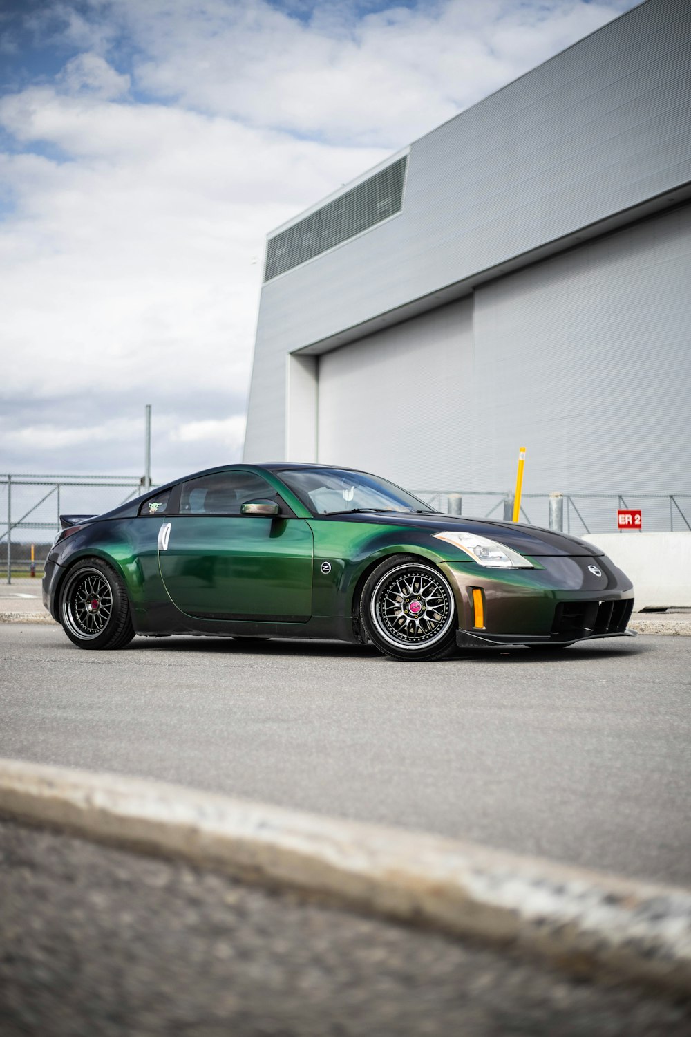 green porsche 911 parked on parking lot