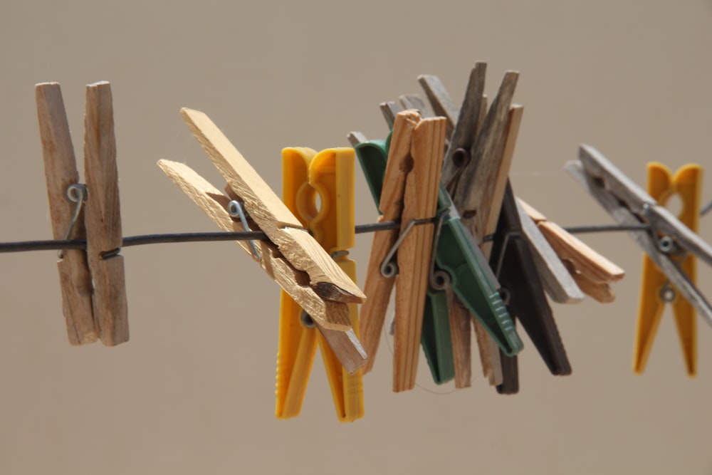 brown wooden clothes pin on white surface