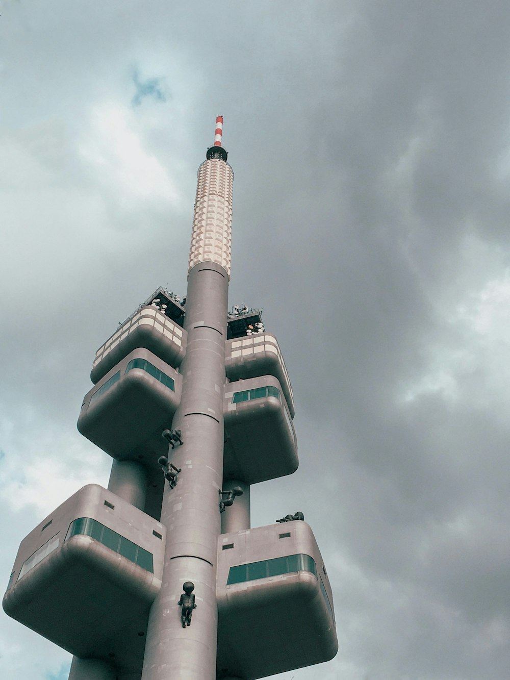 gray and black tower under cloudy sky