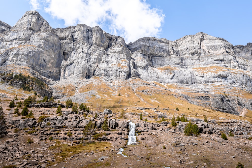 gray rocky mountain under blue sky during daytime