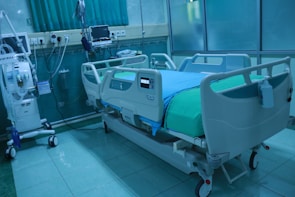 A modern hospital room equipped with advanced medical devices.