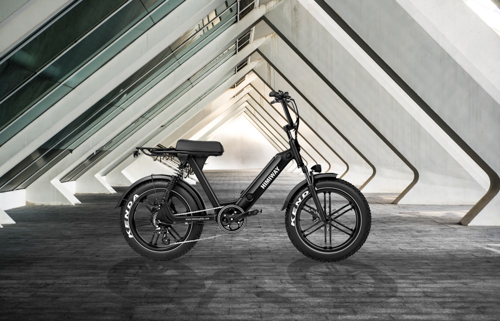 black and gray bicycle on gray concrete floor