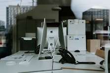 black corded headphones on white table