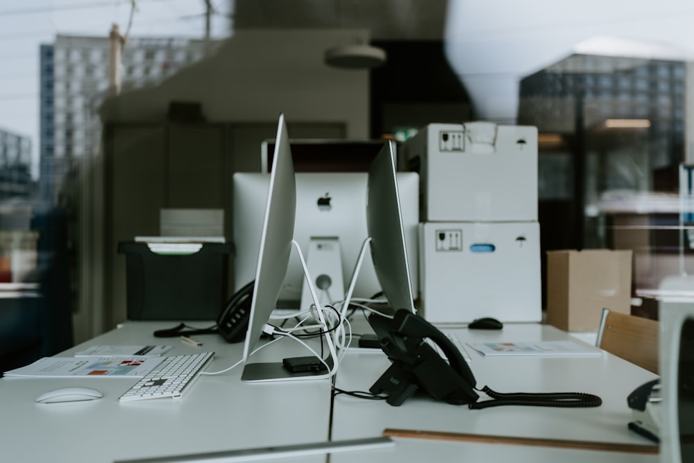 black corded headphones on white table