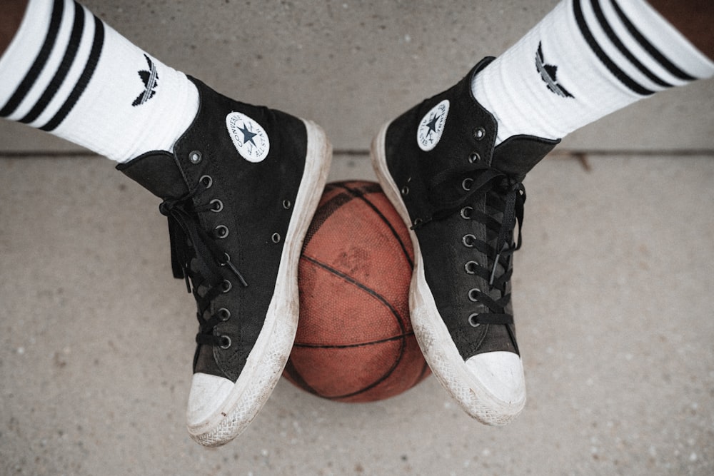 Person wearing black and white converse all star high tops photo – Free  Brown Image on Unsplash