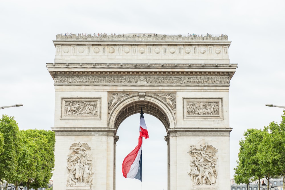 white concrete arch with us flag