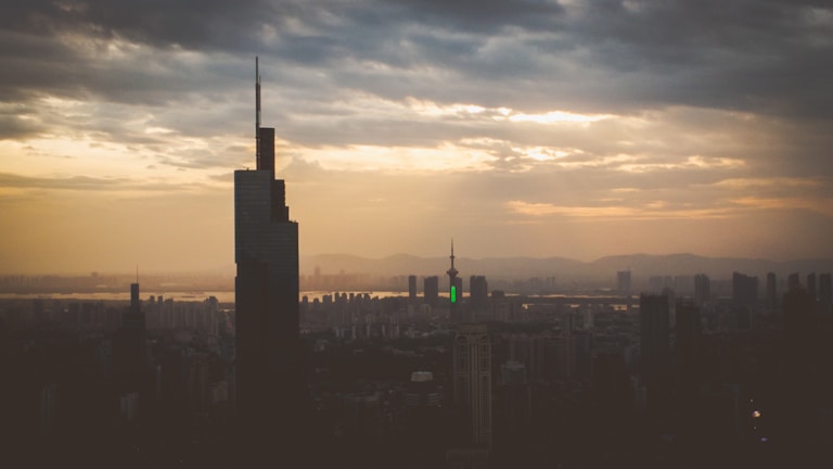 Scenic city skyline at dusk, symbolizing global reach and opportunity.