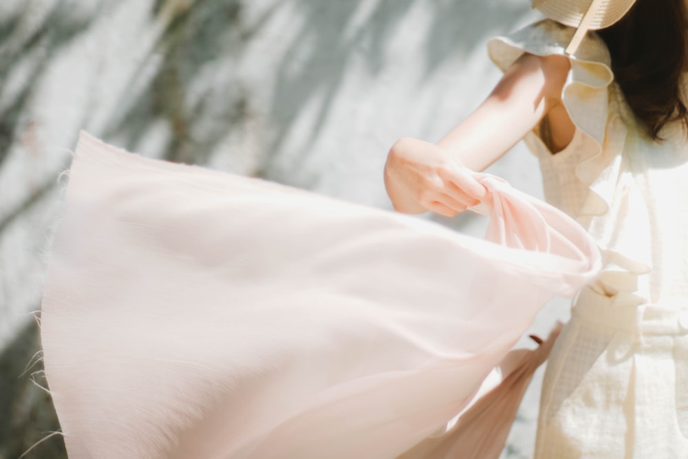 woman in white dress and white hat