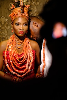 woman in red and gold dress