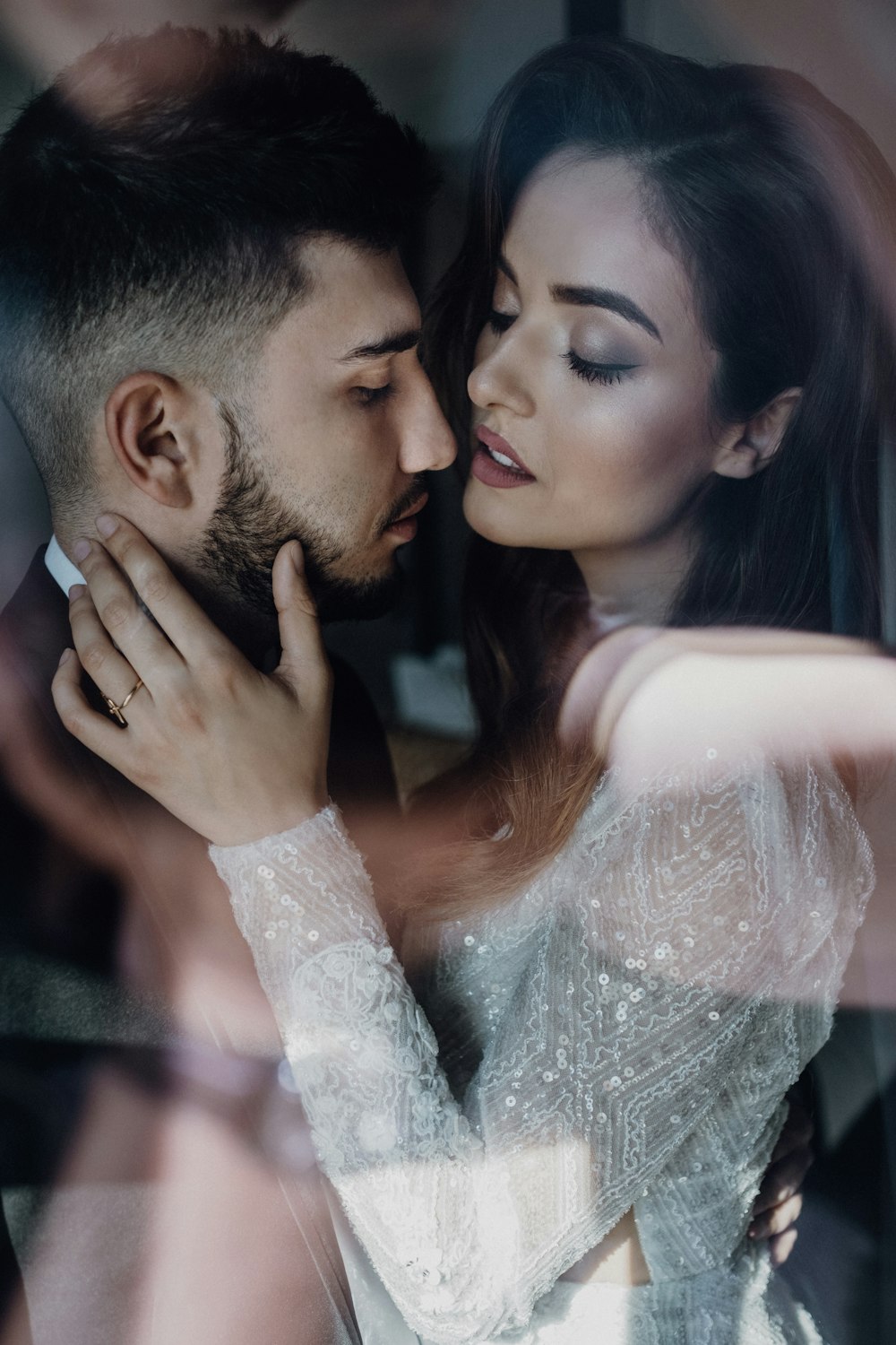 man and woman kissing during daytime