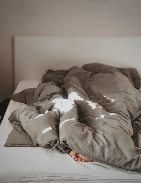 Minimal white bed linen