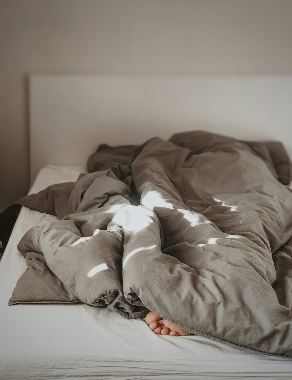 brown and white bed linen