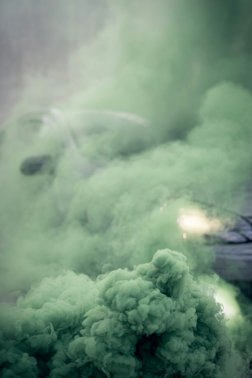 green smoke on white clouds