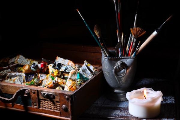 paint brushes in stainless steel bucket