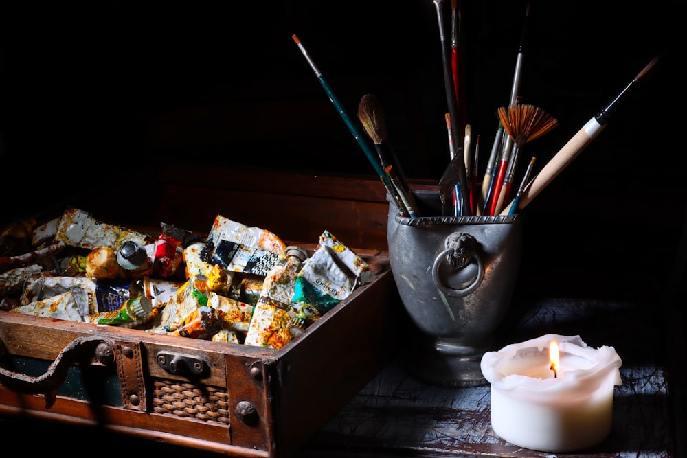 paint brushes in stainless steel bucket