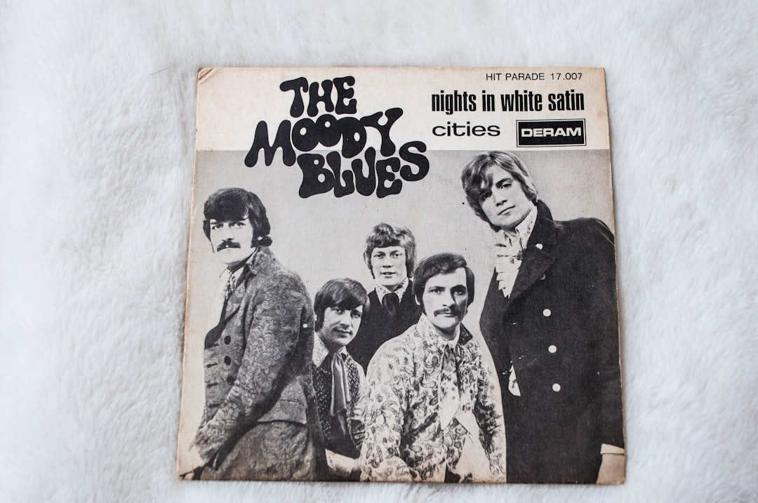 the beatles vinyl record on white textile