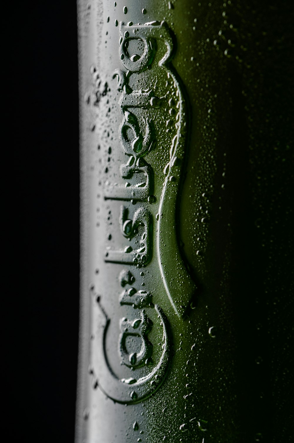 green and white labeled bottle