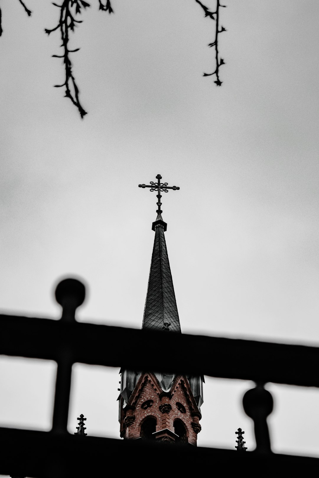 silhouette of cross under cloudy sky