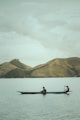 2 person riding on boat on body of water during daytime
