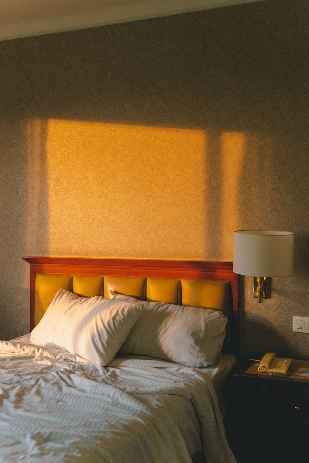 white pillow on white bed