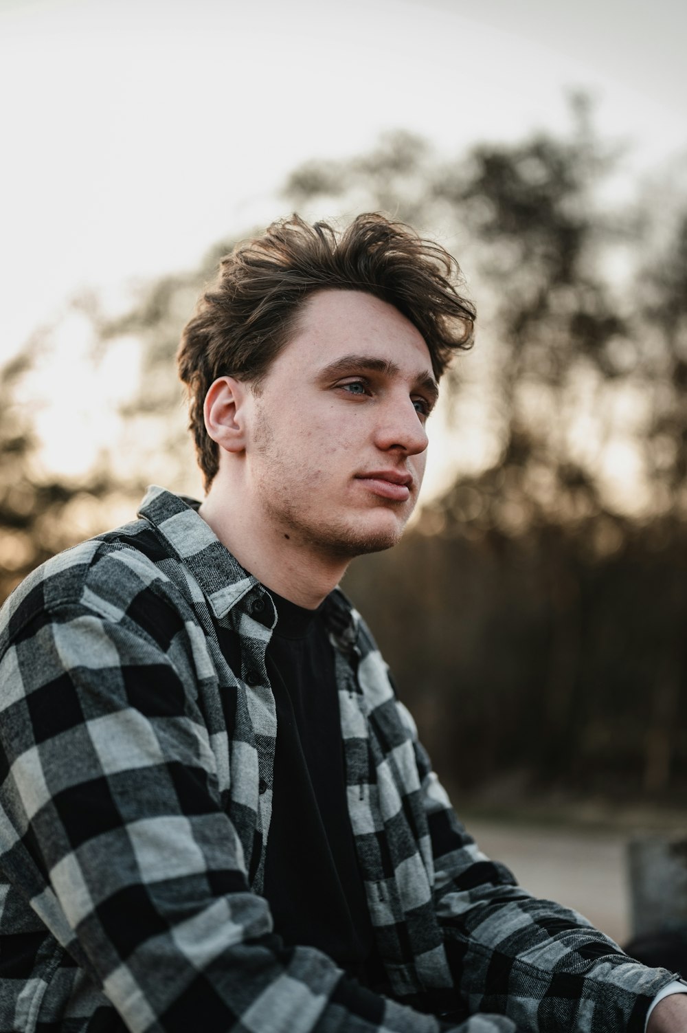 man in black and white plaid dress shirt