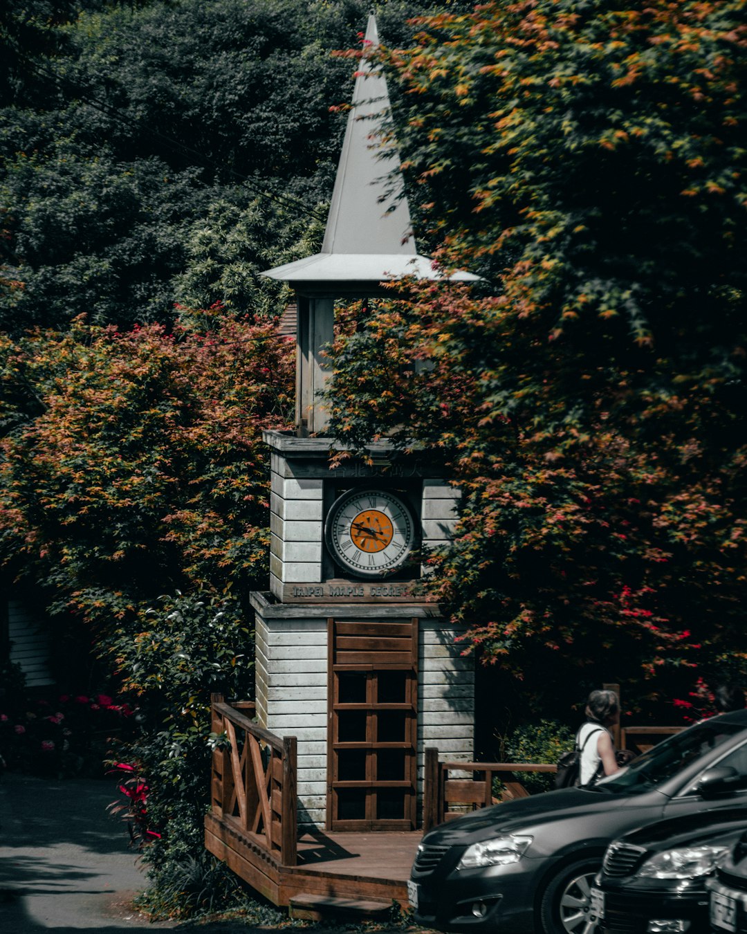 white and brown wooden clock tower