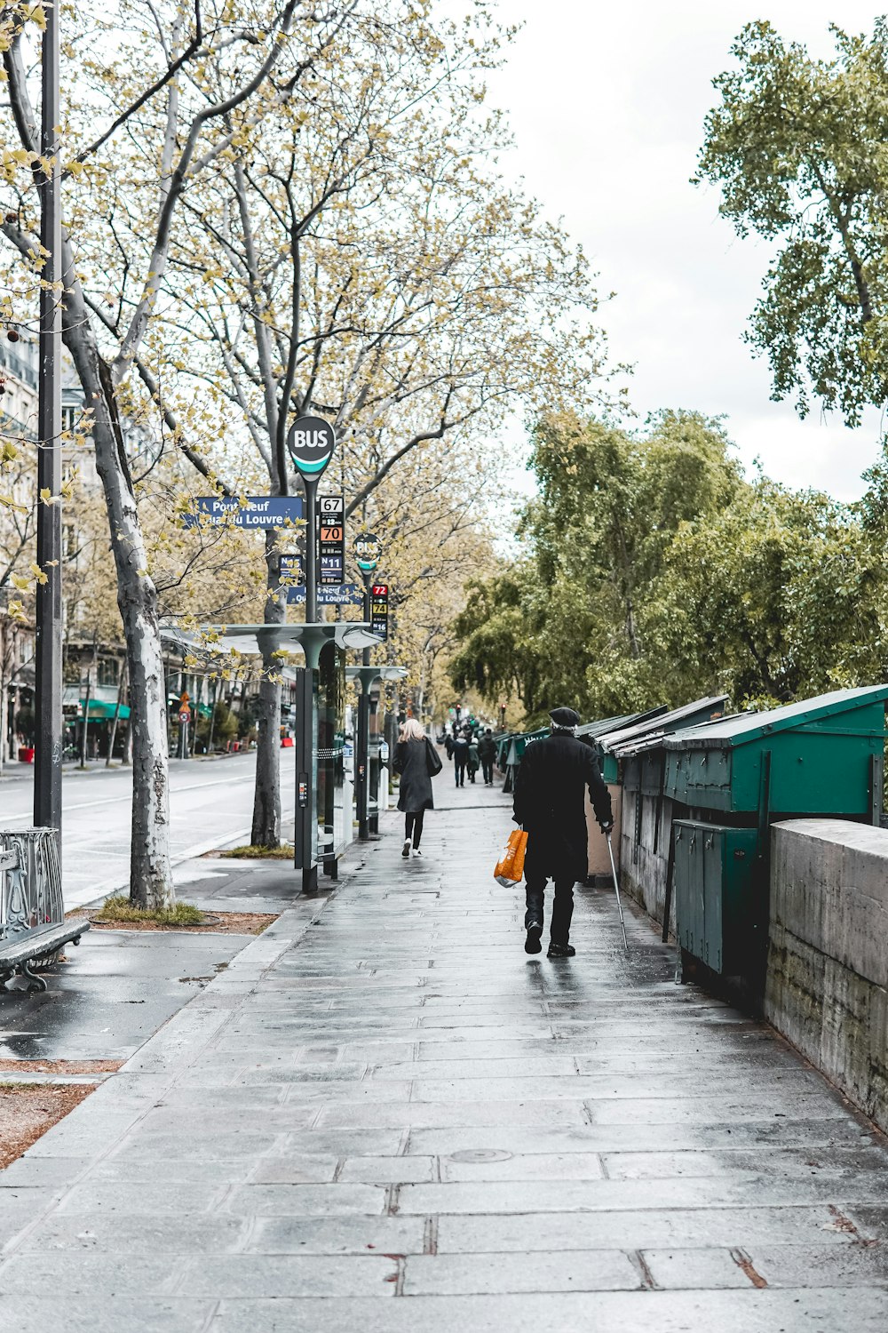 people walking on sidewalk during daytime