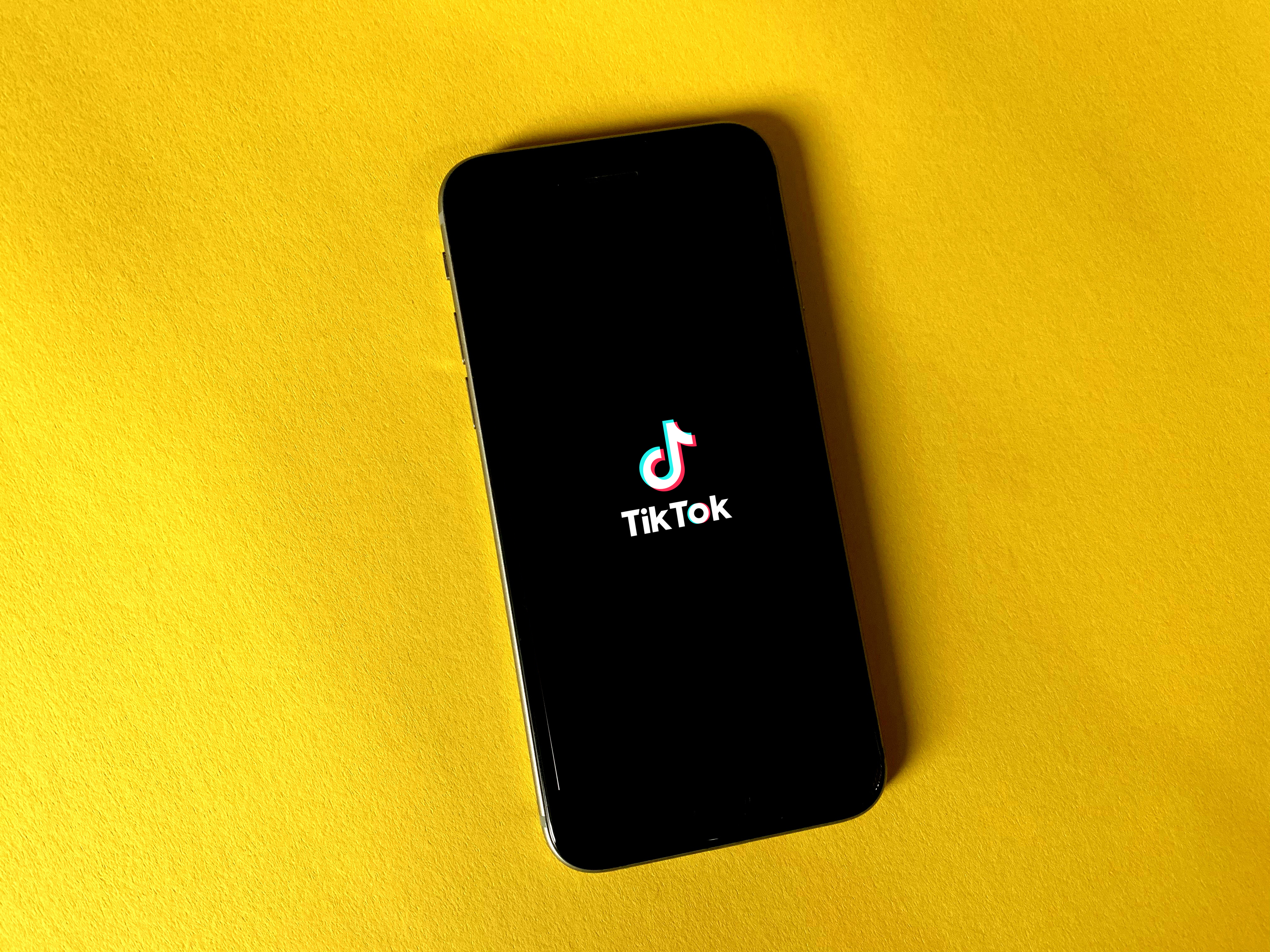 black iphone 7 on yellow textile