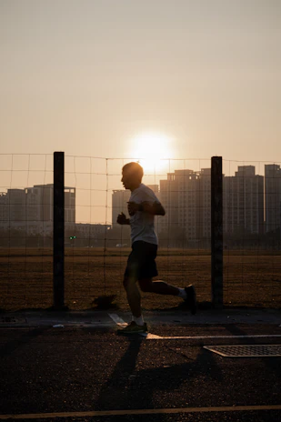 Sunset view of runners finishing a session with Jundiaí cityscape in background