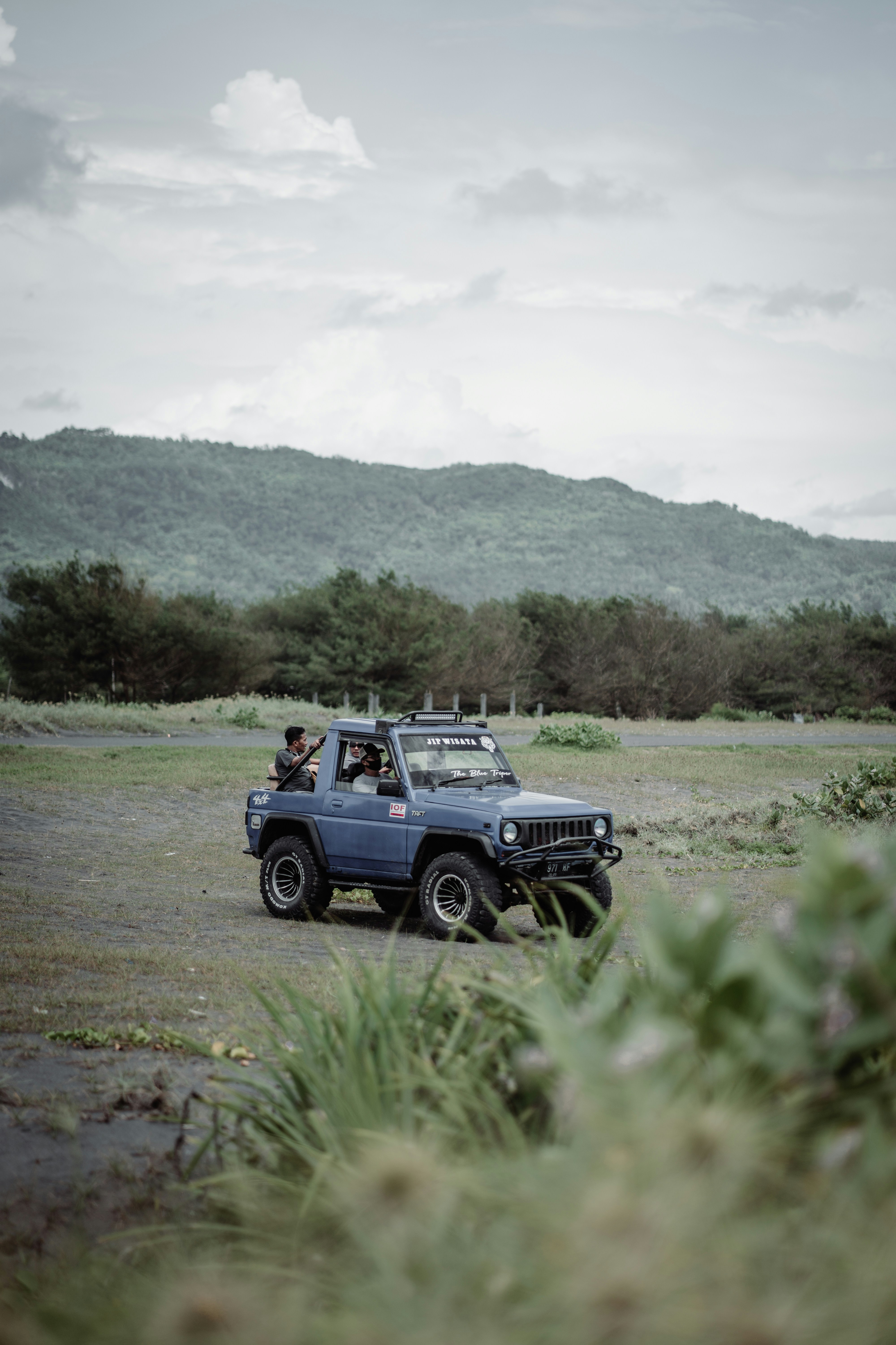 black jeep wrangler on dirt road during daytime