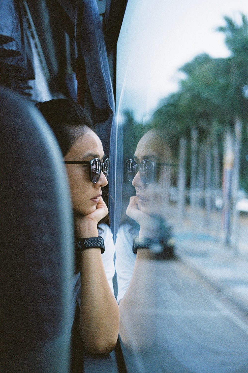 man in black framed eyeglasses and black shirt