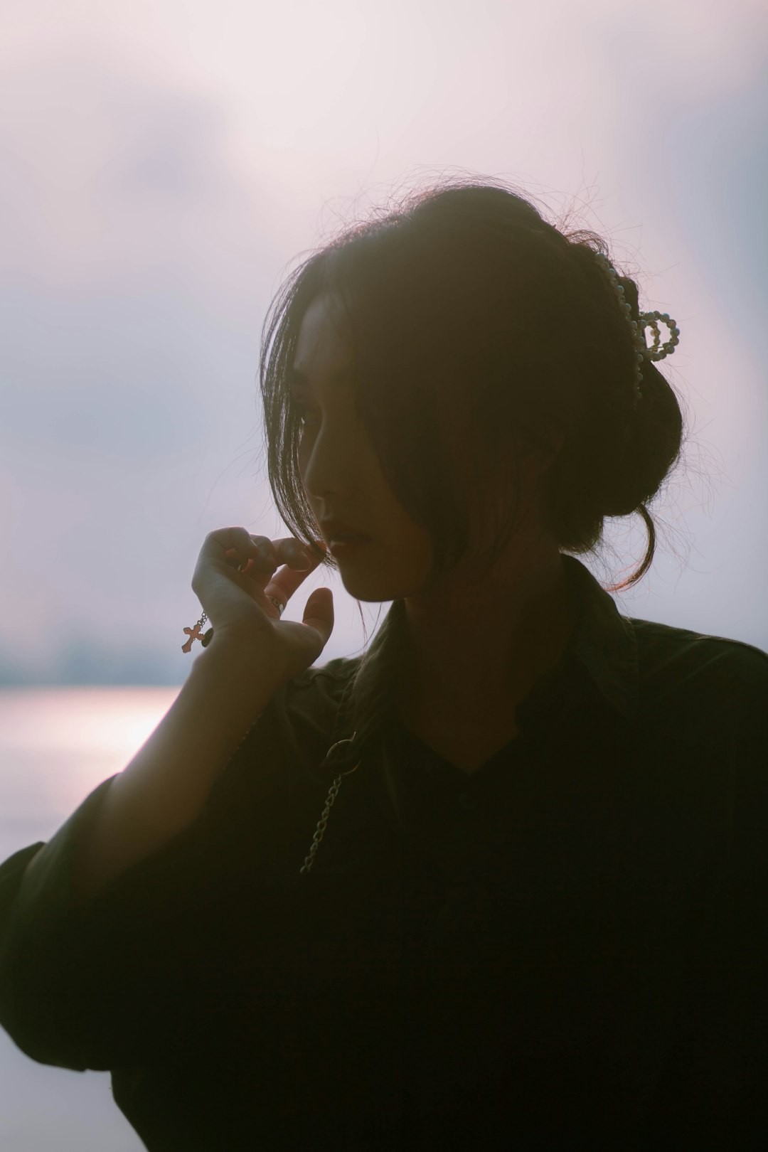 woman in black shirt wearing sunglasses