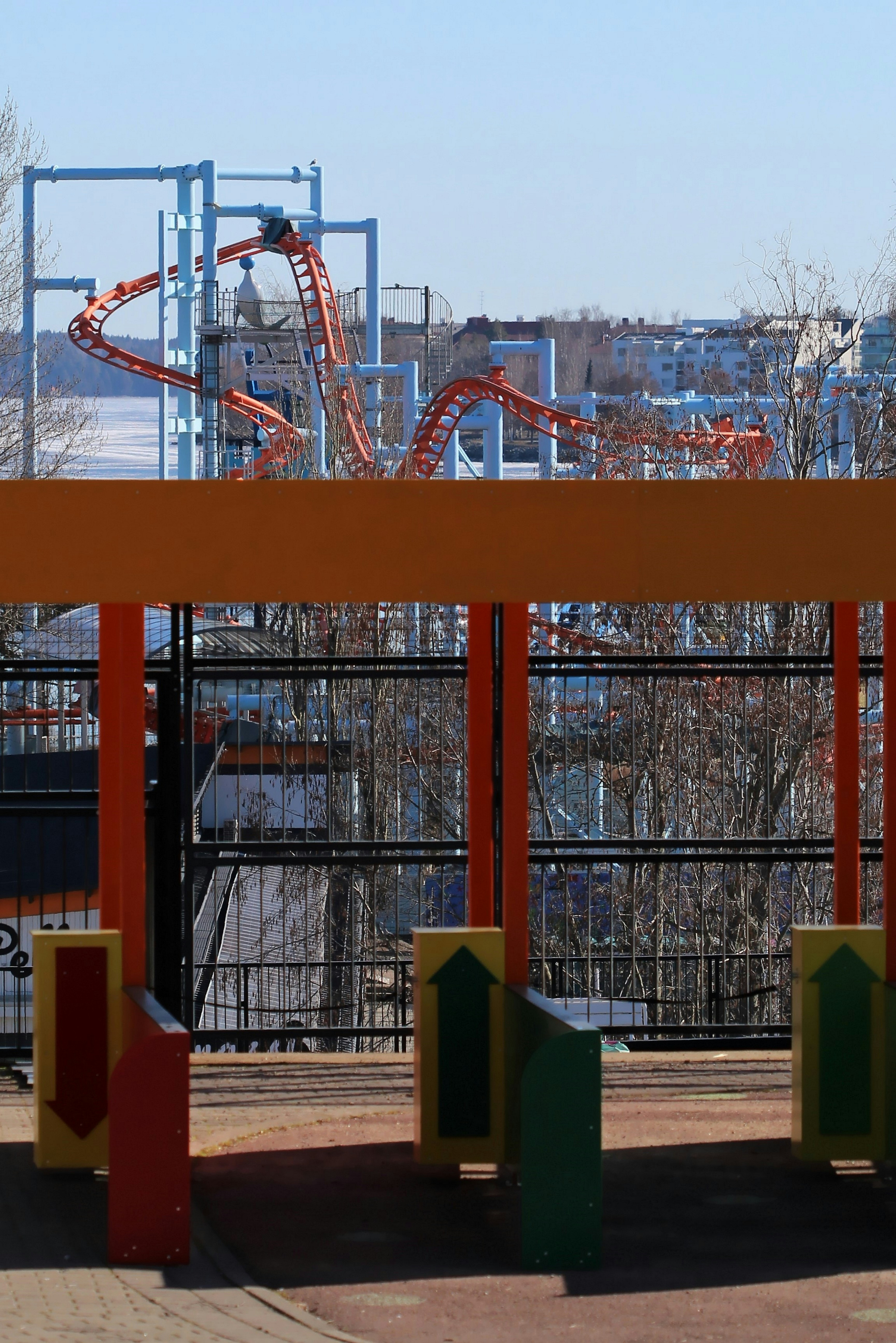 red metal frame building near trees during daytime