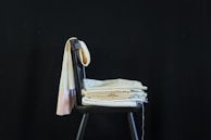 blue bath towel on gray chair
