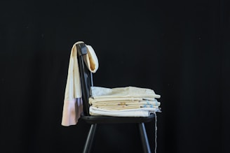 blue bath towel on gray chair