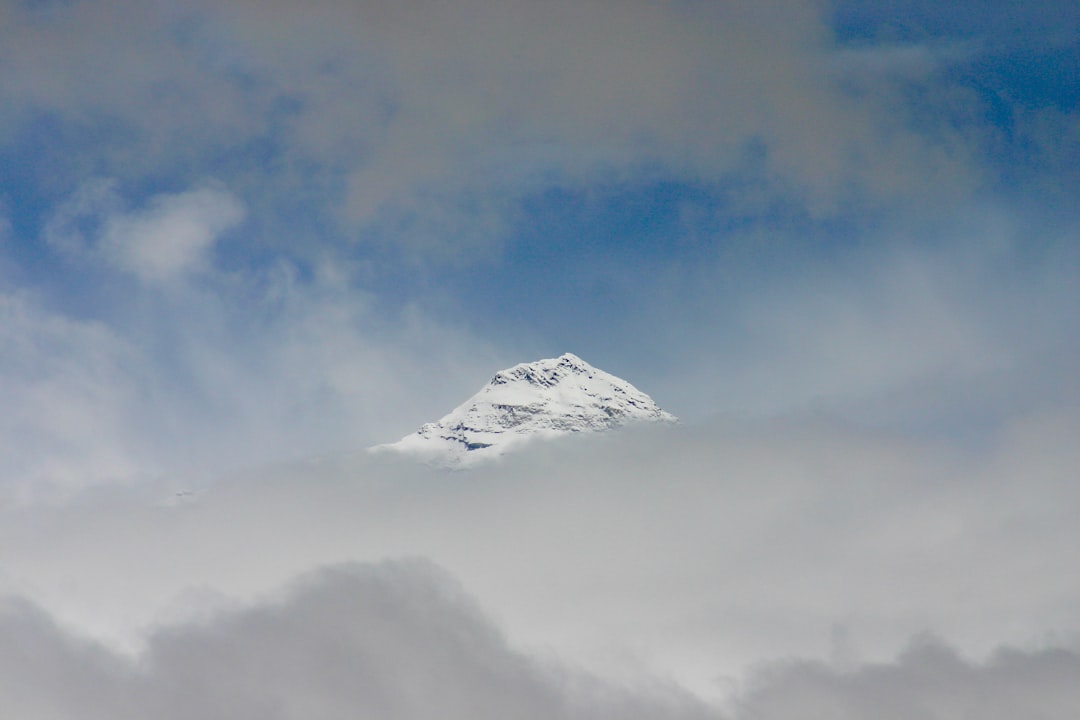 snow covered mountain under blue sky