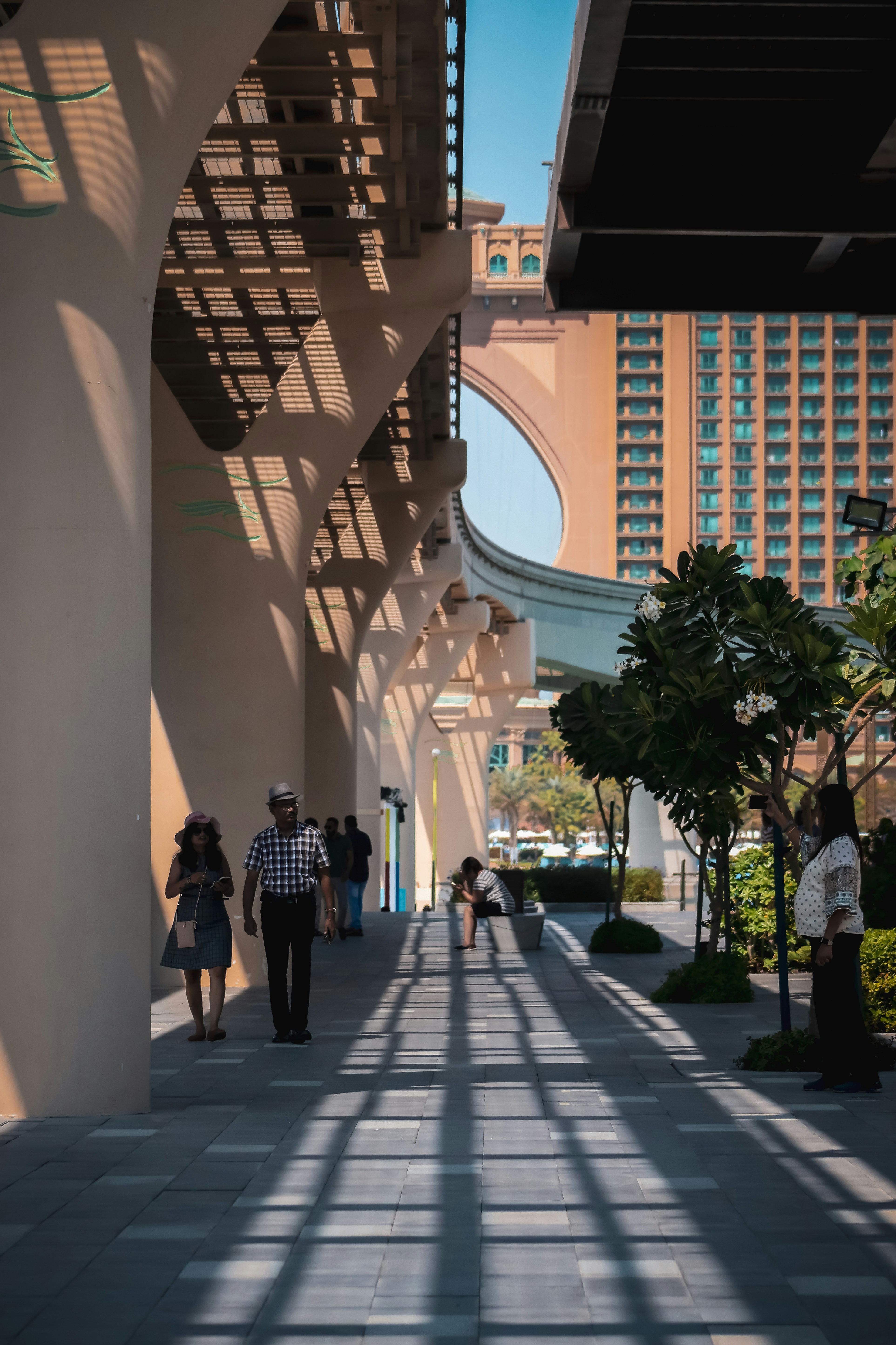 people walking on white concrete building during daytime