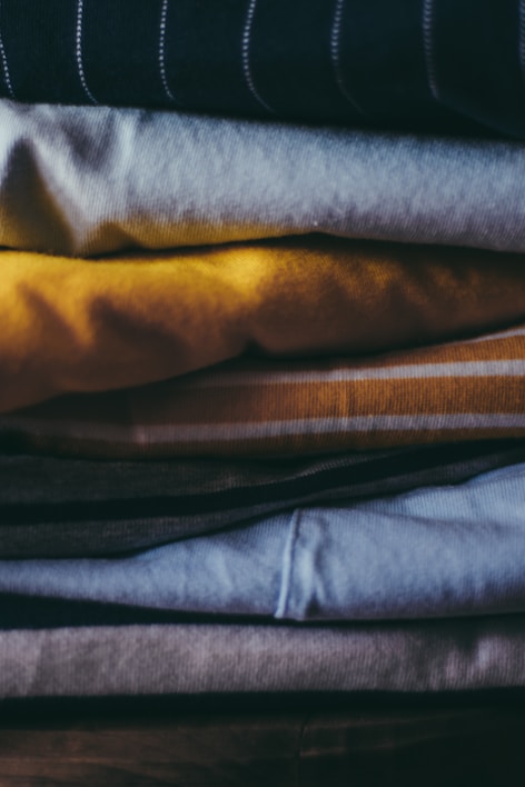 Stacks of neatly folded used clothing ready for shipment in a South Texas warehouse.
